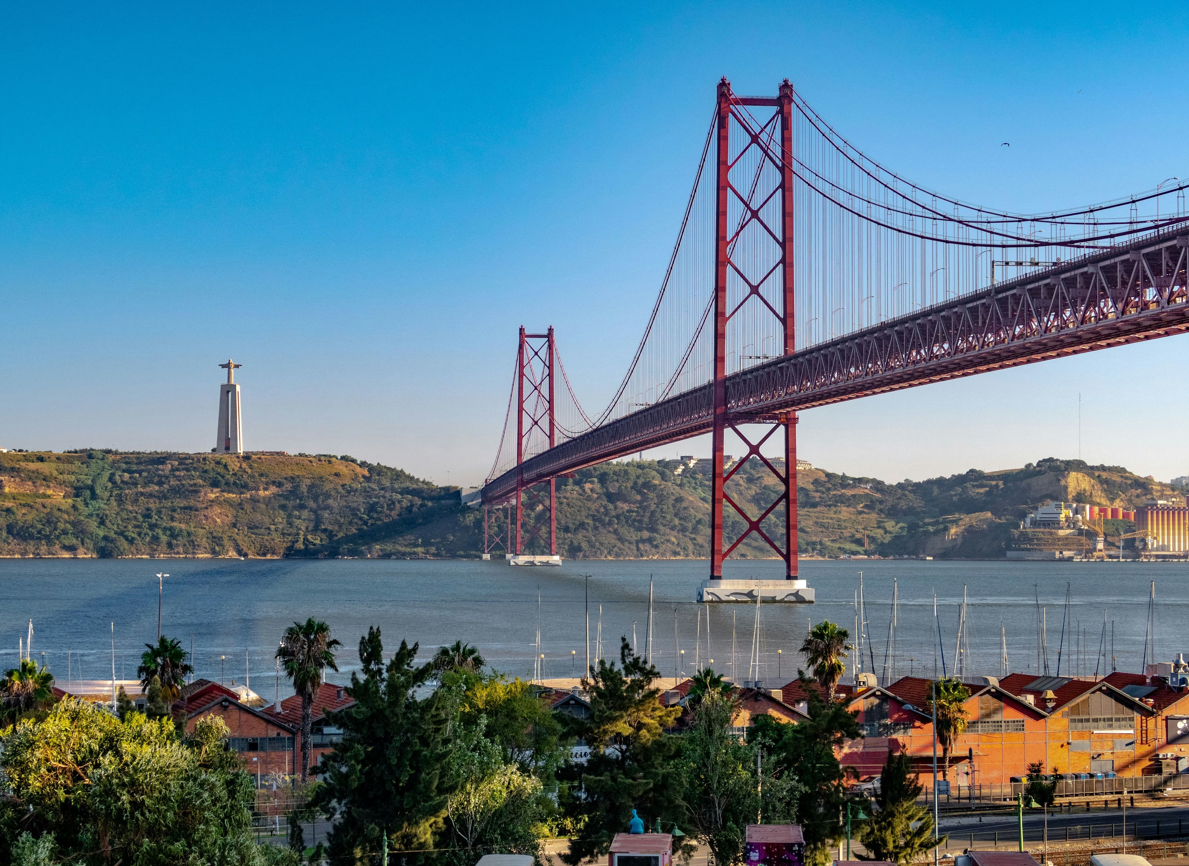 Lisbon iconic bridge over the Tagus river at golden hour